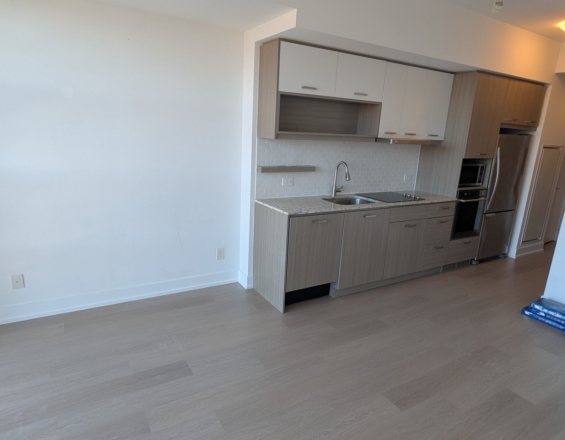 Finished compact kitchen with clean cabinetry
