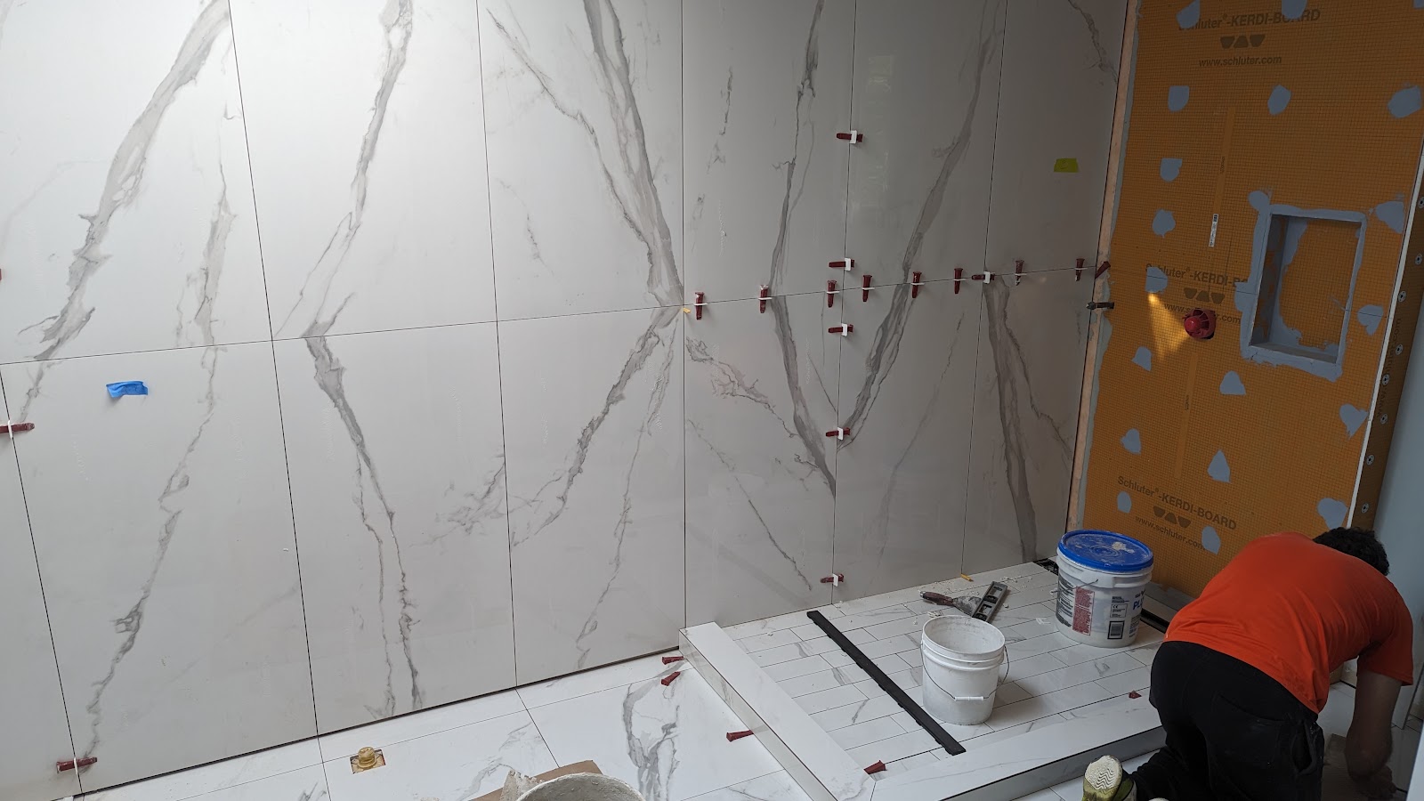 Bathroom shower tile installation in progress